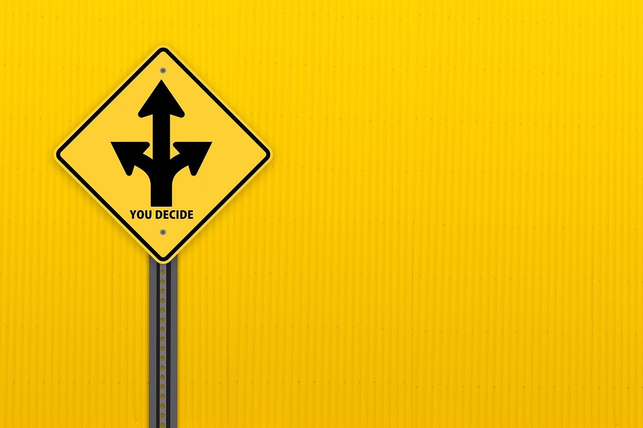 Road Sign indicating difficult decisions ahead
